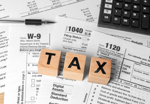 Tax forms (1040, W-9, 1120) with 